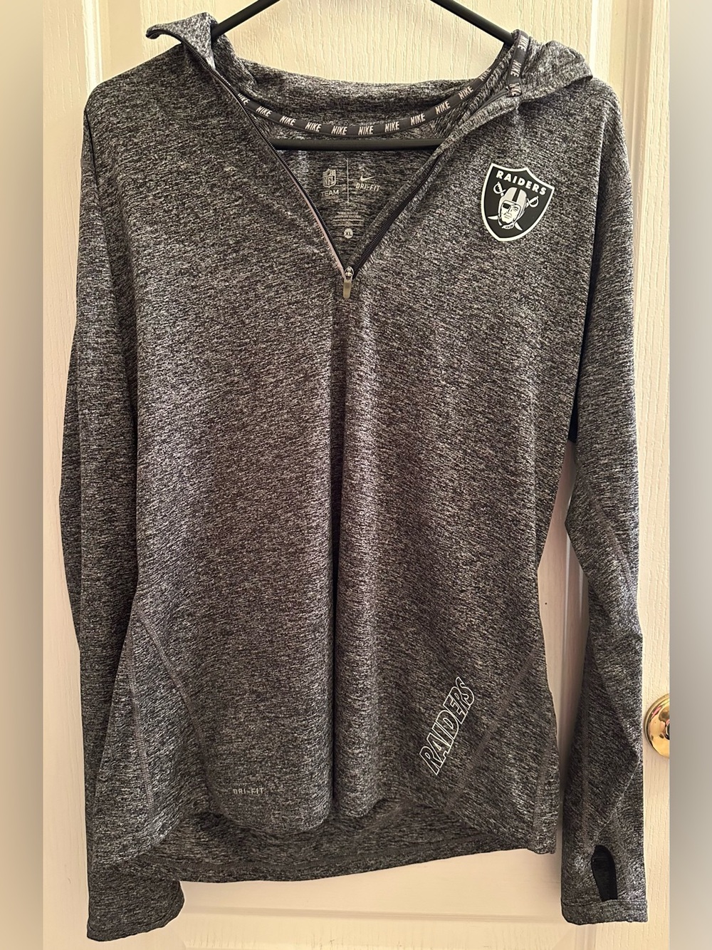 Nike Raiders Dri-fit Heathered 1/4 Zip long sleeve. Heathered grey and black